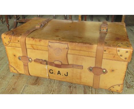 A full hide and studied steamer trunk, bearing the name Finnigns Limited, Makers 18 New Bond Street, London, Manchester and L