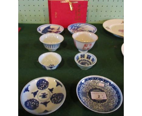 A collection of Chinese Qing dynasty blue and white porcelain, to include: teacups & saucers, a Celedon blue & white wine cup