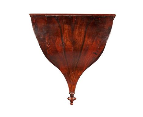 A Regency sabicu clock wall bracket With rectangular top, tapering sides and pendant finial, 25cm wide, 16cm deep, 26cm high.