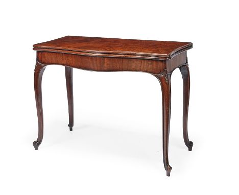 A George III carved mahogany serpentine concertina-action card table in the French Hepplewhite tasteThe hinged rectangular mo