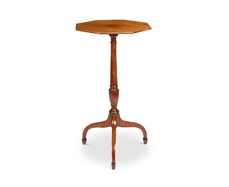 A George III mahogany occasional table The octagonal top above a baluster turned shaft on downswept tripod legs and spade fee