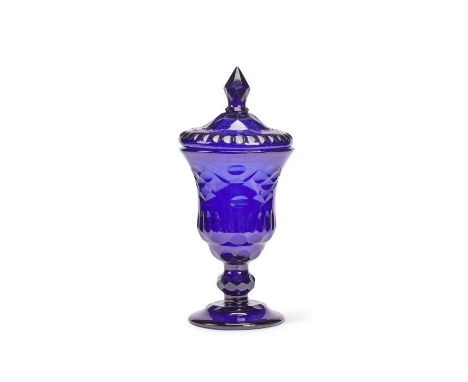 A large late 18th century blue cut-glass goblet and cover
The lid with finial; the goblet with facetted stem and circular bas