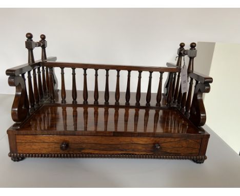 A Regency rosewood double-side book carrier attributed to Gillows of Lancaster and London
The rectangular top with spindle di