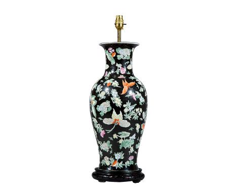 A Chinese-Export famille noir porcelain vase converted to a table lamp Decorated with insects and flowers on a black ground, 