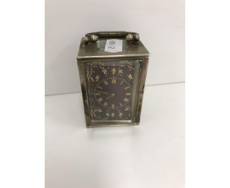 A late 19th Century French silver cased miniature carriage clock with red guilloche enamel dial with yellow and white metal e