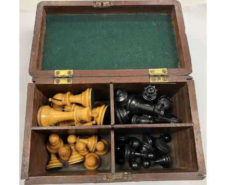 A late George III mahogany tea caddy with added four section interior containing a Staunton type boxwood and ebonised chess s