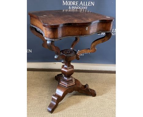 An early Victorian rosewood work table, the plain rising top with serpentine front opening to reveal a multi lidded compartme
