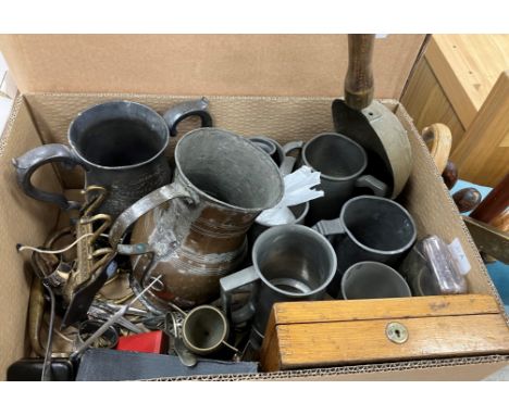 A collection of metal wares to include assorted pewter tankards and measures, various brass and iron pots, a small quantity o
