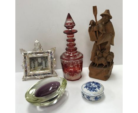 A 19th Century Continental faceted glass ruby flash decanter and stopper, 33 cm high and a carved wooden figure of "Shepherd"