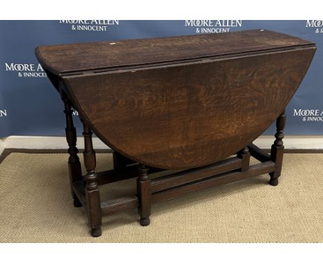 A 19th Century oak oval gate-leg drop leaf dining table 119 cm x 135 cm x 75 cm high together with a late 19th or early 20th 