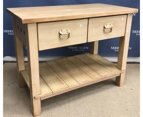 A modern beech and pine kitchen island, or work table, with two drawers on square supports united by a planked pot shelf, 120