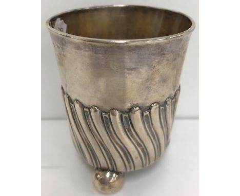 A 19th Century French white metal (.950) tumbler cup with wrythen embossed decoration and engraved with initials and date "18