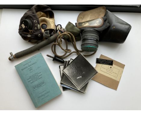 A World War II leather flying helmet (Provenance: Mr Alan Mould - grandfather Spitfire pilot, together with breathing apparat