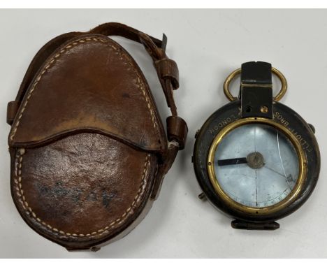 An Elliott Brothers of London compass inscribed verse "A O Boyd", housed in a brown leather outer case