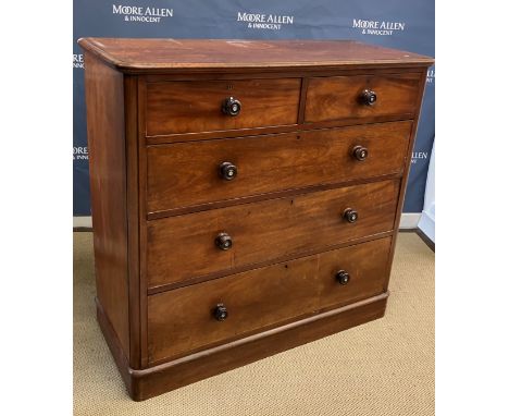 A Victorian mahogany chest, the plain top with moulded edge over two short and three long graduated drawers with turned knob 