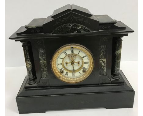 A Victorian black and green marble cased architectural mantel clock, the eight day movement with visible escapement and Roman