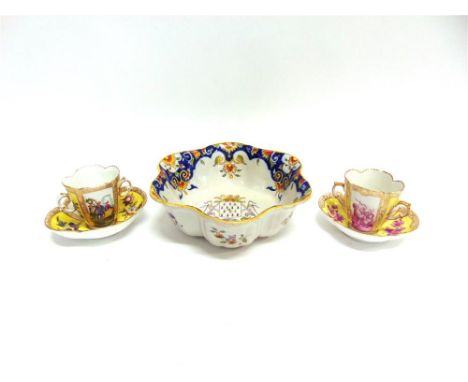 TWO SIMILAR AUGUSTUS REX CABINET CUPS AND SAUCERS,  with alternating painted reserves depicting courting couples and cherubs,