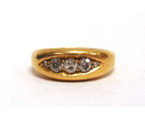 A FIVE STONE DIAMOND 18 CARAT GOLD RING Birmingham 1908, the three old cut brilliants, totalling approximately 0.39 carats, w