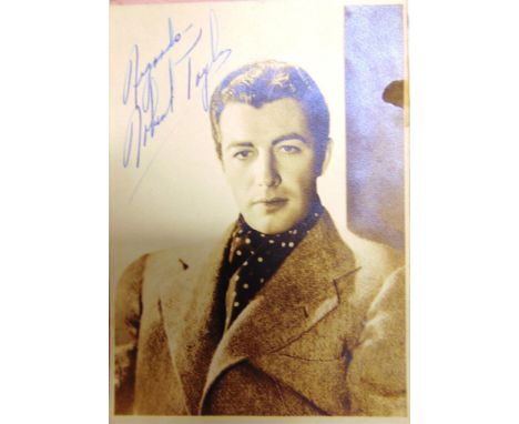 AN AUTOGRAPH ALBUM the signatures including Ronald Colman; Laurence Olivier (mounted photograph); Robert Donat (mounted theat