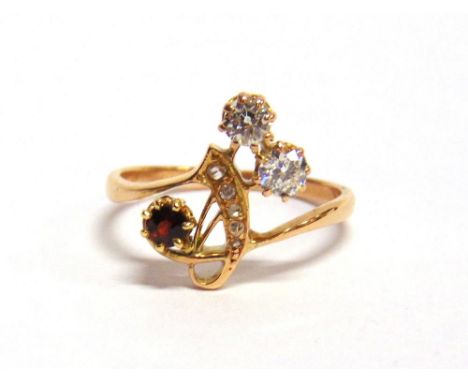 A DIAMOND AND GARNET ART NOUVEAU STYLE RING the two old cut brilliants totalling approximately 0.24 carats, with three rose c