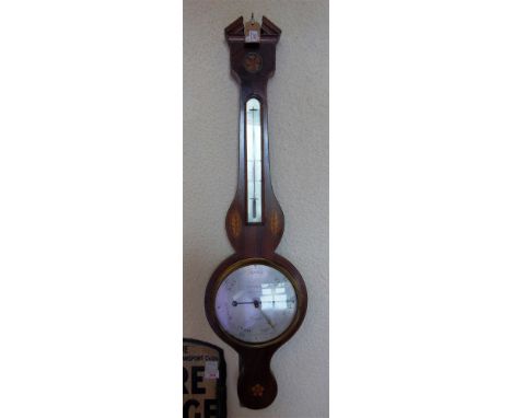 A GEORGE III INLAID MAHOGANY WHEEL BAROMETERthe silvered eight inch dial engraved 'G Soldini Wincanton' beneath thermometer, 