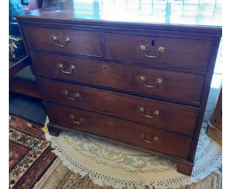 A George III mahogany chest with stepped, moulded cornice, blind fretwork and later handles and escutcheons A/F, with later b
