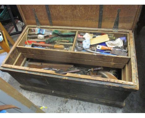 A twin handled chest containing vintage tools to include woodworking planes and other mixed tools 