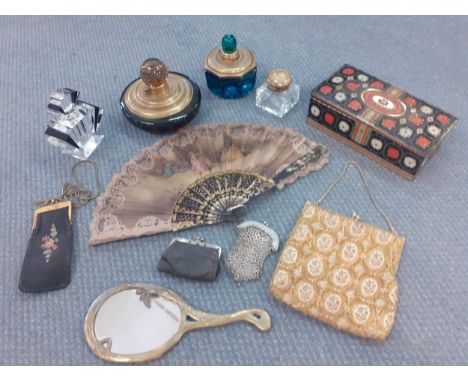 Decorative vintage ladies boudoir and evening items to include 4 scent bottles, a white metal chain purse, a fan and an Art N