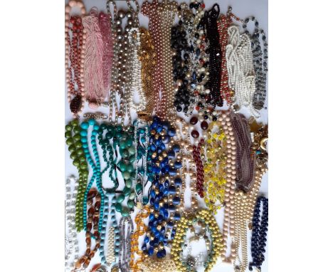 A quantity of vintage bead necklaces A/F, to include glass examples and a string of Aurora Borealis beads together with a qua