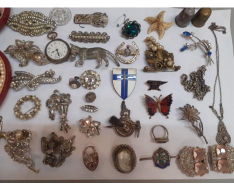 Vintage costume jewellery and ladies watches to include silver tone and marcasite/white paste brooches, an early 20th Century