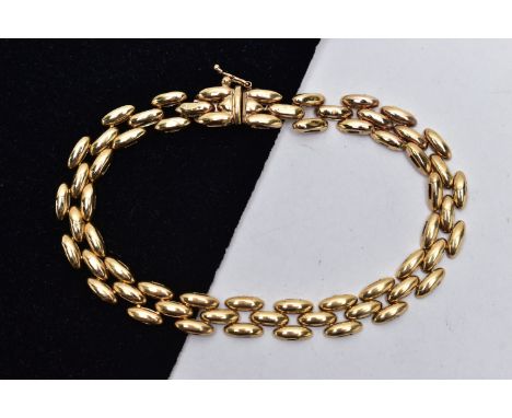 A 9CT YELLOW GOLD BRACELET, brick link bracelet fitted with an push piece clasp, with additional figure of eight safety clasp