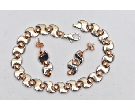 A 9CT BI-COLOUR BRACELET AND MATCHING EARRINGS, the bracelet designed with a series of white 'S' links each interspaced with 