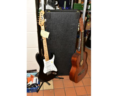 A SQUIER BY FENDER STRATOCASTER GUITAR with black body, white scratch plate, three single coil pickups, one piece maple neck,