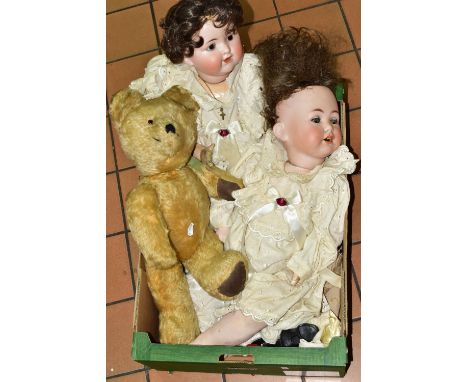 TWO EARLY 20TH CENTURY BISQUE HEAD DOLLS AND A BEAR, comprising a wood/wool stuffed bear with disc joints, one glass eye, ori