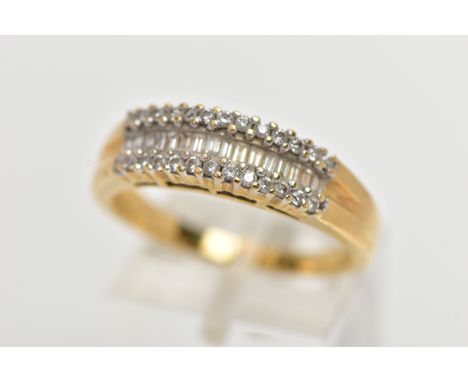 AN 18CT YELLOW GOLD DIAMOND HALF ETERNITY RING, designed with a central row of baguette cut diamonds, between two rows of cla