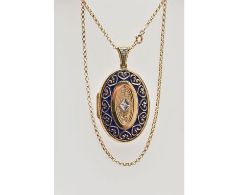 A 14CT GOLD ENAMEL AND DIAMOND SET LOCKET PENDANT AND CHAIN, the locket of an oval form, decorated with a navy blue enamel an