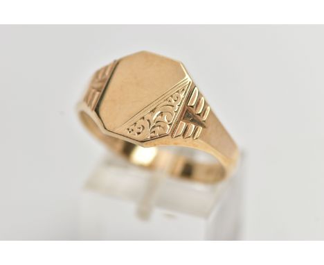 A 9CT GOLD SIGNET RING, yellow gold signet ring, engraved with a scrolling design and textured shoulders, approximate width 1