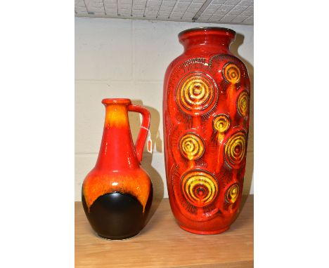 A BAY WEST GERMAN FAT LAVA BALUSTER VASE AND BAY FAT LAVA EWER, the red ground vase with textured red /orange /yellow swirls 