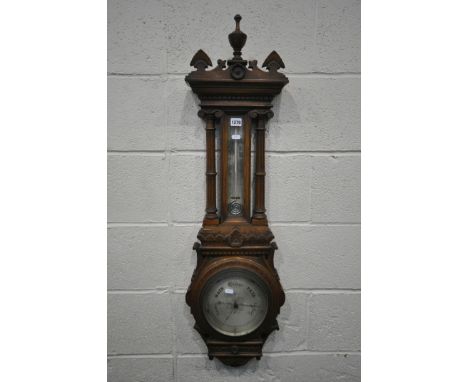 A LATE VICTORIAN OAK ANEROID BAROMETER, with a spiralling mercury thermometer, height 107cm (condition:-missing veneer above 