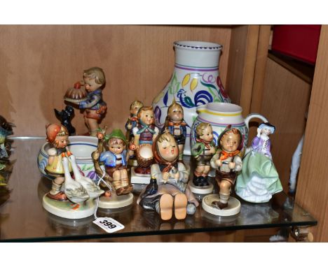 A GROUP OF HUMMEL FIGURINES, POOLE POTTERY AND A ROYAL DOULTON FIGURINE, comprising nine Hummel figurines: Begging His Share,