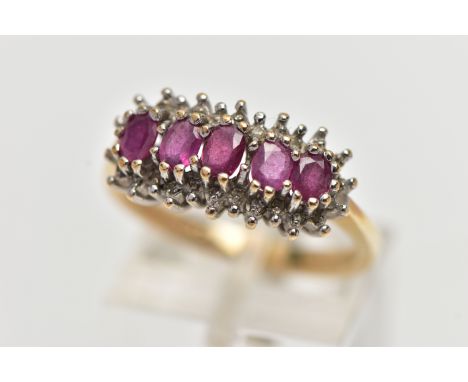 A 9CT YELLOW GOLD RUBY AND DIAMOND CLUSTER RING, the cluster of an oval form, to the center is five claw set, oval cut rubies