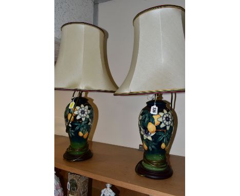 A PAIR OF MOORCROFT POTTERY 'PASSION FLOWER' TABLE LAMPS, of baluster form, with tube lined passion flowers and fruit design 