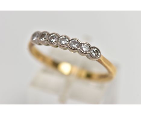 AN 18CT GOLD SEVEN STONE DIAMOND RING, a row of collet set round brilliant cut diamonds, estimated total diamond weight 0.35c