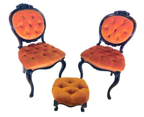 A set of six 19thC rosewood balloon back chairs, each with a flower carved crest, an orange velvet upholstered button back an
