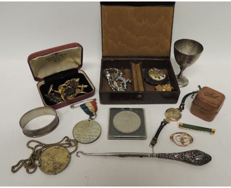 A ladies 9ct gold wristwatch; 9ct gold and jade bar brooch; costume jewellery; travelling inkwell; cufflinks; silver napkin r