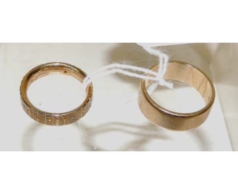 A wide 9ct gold band ring, size S+, 7g approx.; and another 9ct gold band ring set with tiny diamonds, the ring with deeply e
