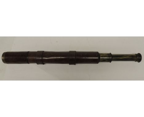 A Negretti & Zambra military two draw telescope no.1025, dated 1901 and with military arrow, the brass instrument with brown 