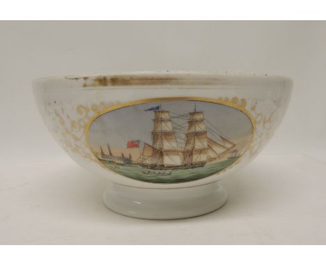 A 19th Century porcelain punch bowl having oval painted panel of a British ship under sail, a Continental building beyond, wi