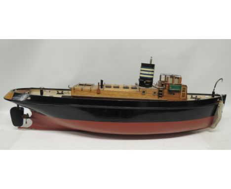 A large battery powered model of a steam boat, the painted wood model with good deck detail and with original engine still fi