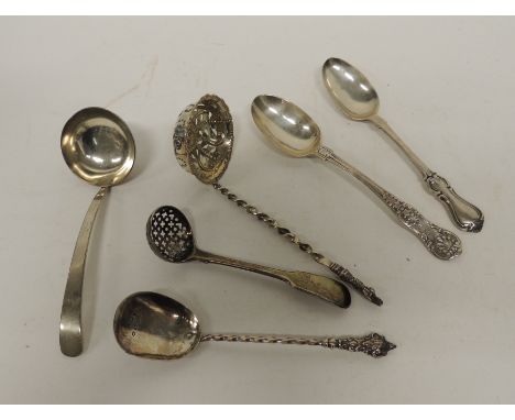A Victorian sifter spoon with apostle terminal, twisted shaft and pierced and embossed bowl, London 1882; a George III fiddle